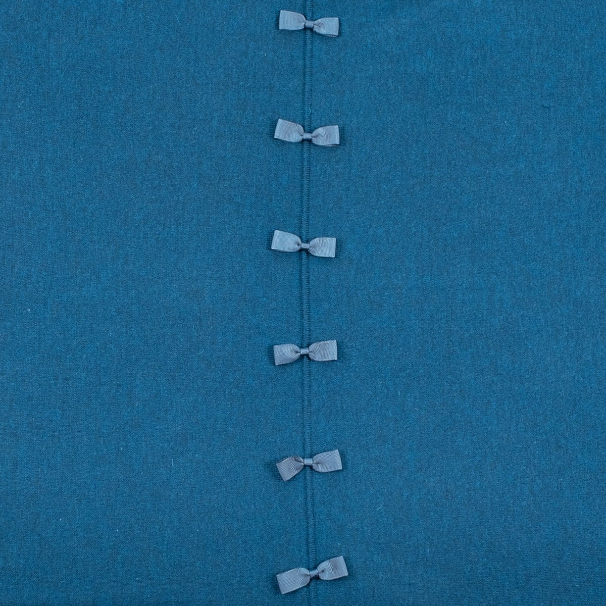 Ginger Toby bow back jumper, teal, detail view