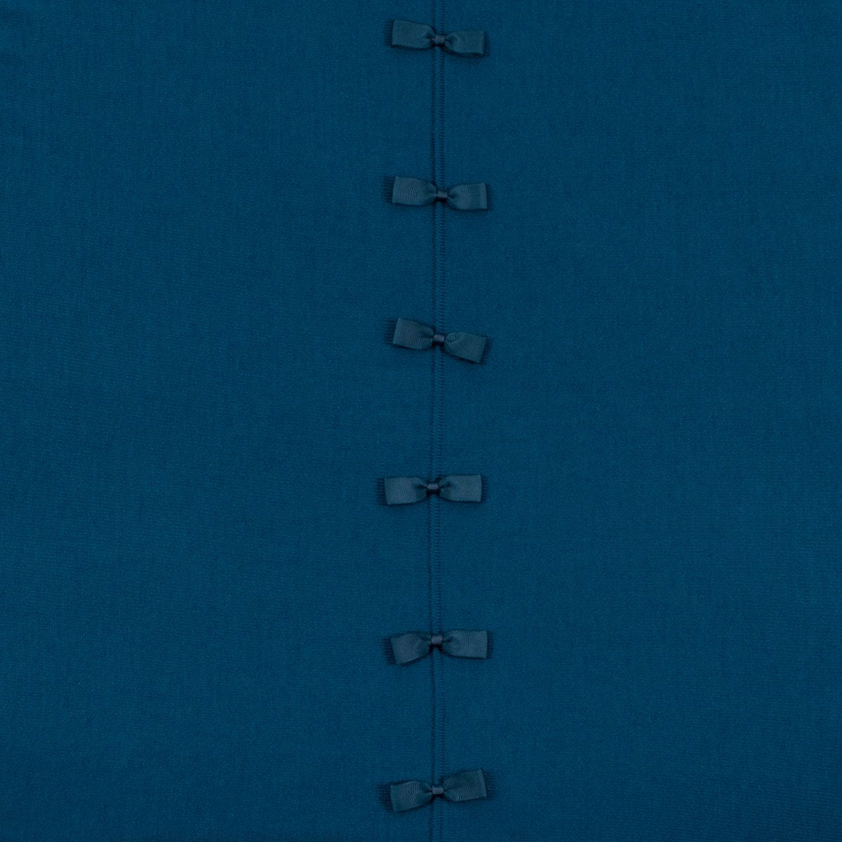 Ginger Toby bow back jumper, petrol, detail view